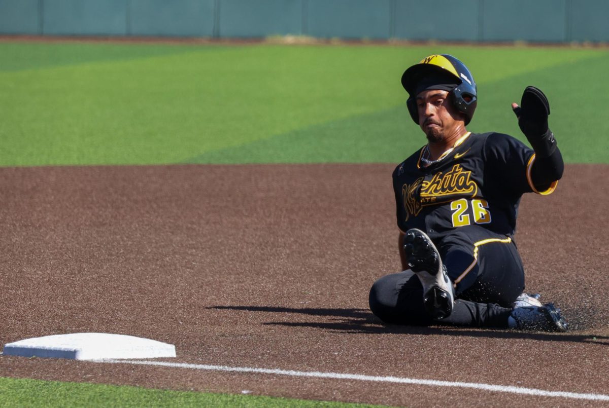 Junior Kaleb Duncan (26) slides into third base against Nebraska on Saturday, Sept. 27, 2025, in Wichita, Kansas. Duncan made 34 starts in center field last season for Wichita State baseball.