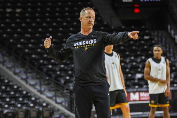 Head coach Paul Mills directs traffic during an open practice on Sept. 18. The 2025-26 season will be Mills' third year on staff.
