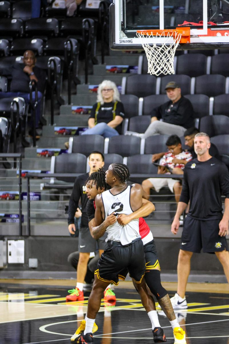Guards Joy Ighovodja and TJ Williams fight for positioning during a practice on Sept. 18. Williams and Ighovodja are two of three returners on this year's roster.