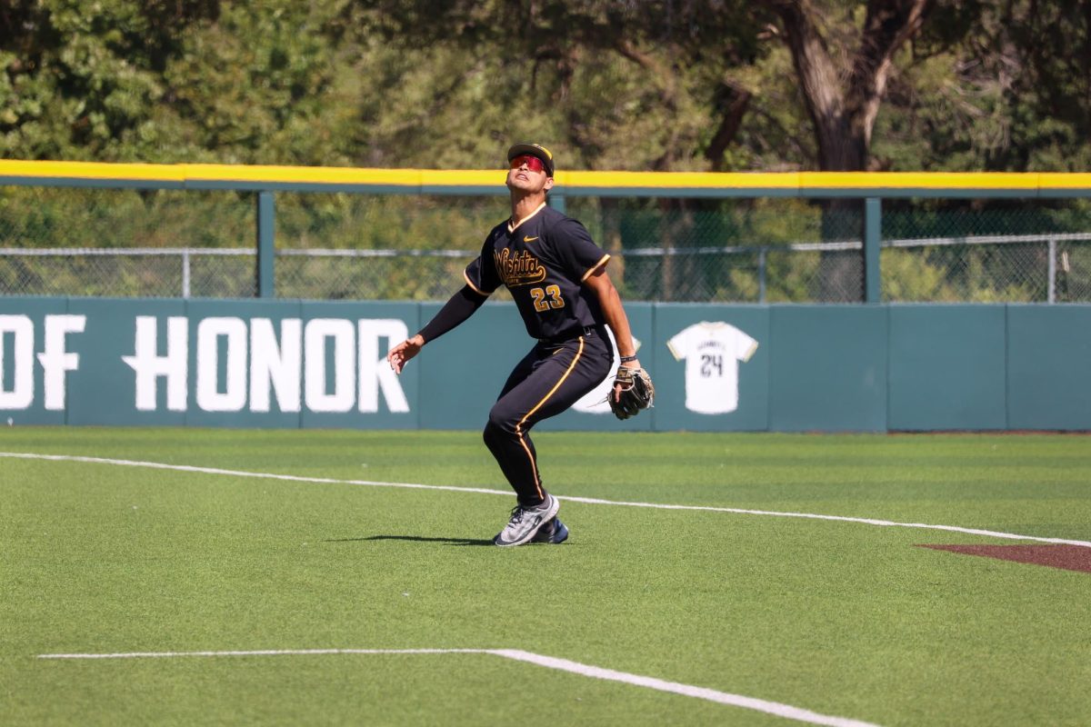 Senior Jayson Jones (23) tries to locate a fly ball on Saturday, Sept. 27, 2025, in Wichita, Kansas. Jones was the Shockers' starting third basemen during the game against Nebraska.