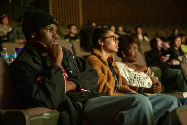 Freshman Leeshaud Woodson (left), sophomore Allison Chaney and sophomore Otun Olaotan watch Princess and the Frog. Friday's showing was part of a collaboration between Alpha Kappa Alpha and the Student Activities Council.