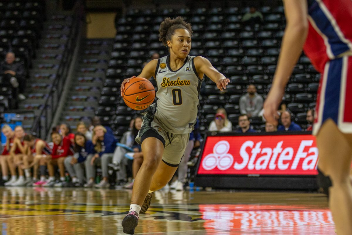 Wichita State women's basketball guard Azjah Reeves (0) directs traffic on Oct. 29. Reeves is one of five juniors on the Shockers' roster.