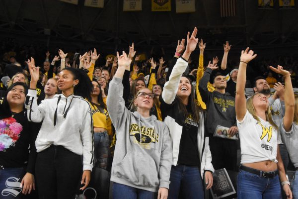 Wichita State's student section holds the Shockers Up hand sign before the exhibition game on Tuesday, Oct. 29, 2019. (File photo)