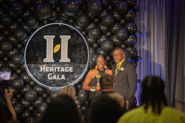 Gwen and Maurice Duggins accept the Wichita State Young Alumni Award on their daughter's, Kiah Duggins, behalf. Kiah was one of the 67 people who lost their lives in the flight 5342 plane collision in January.