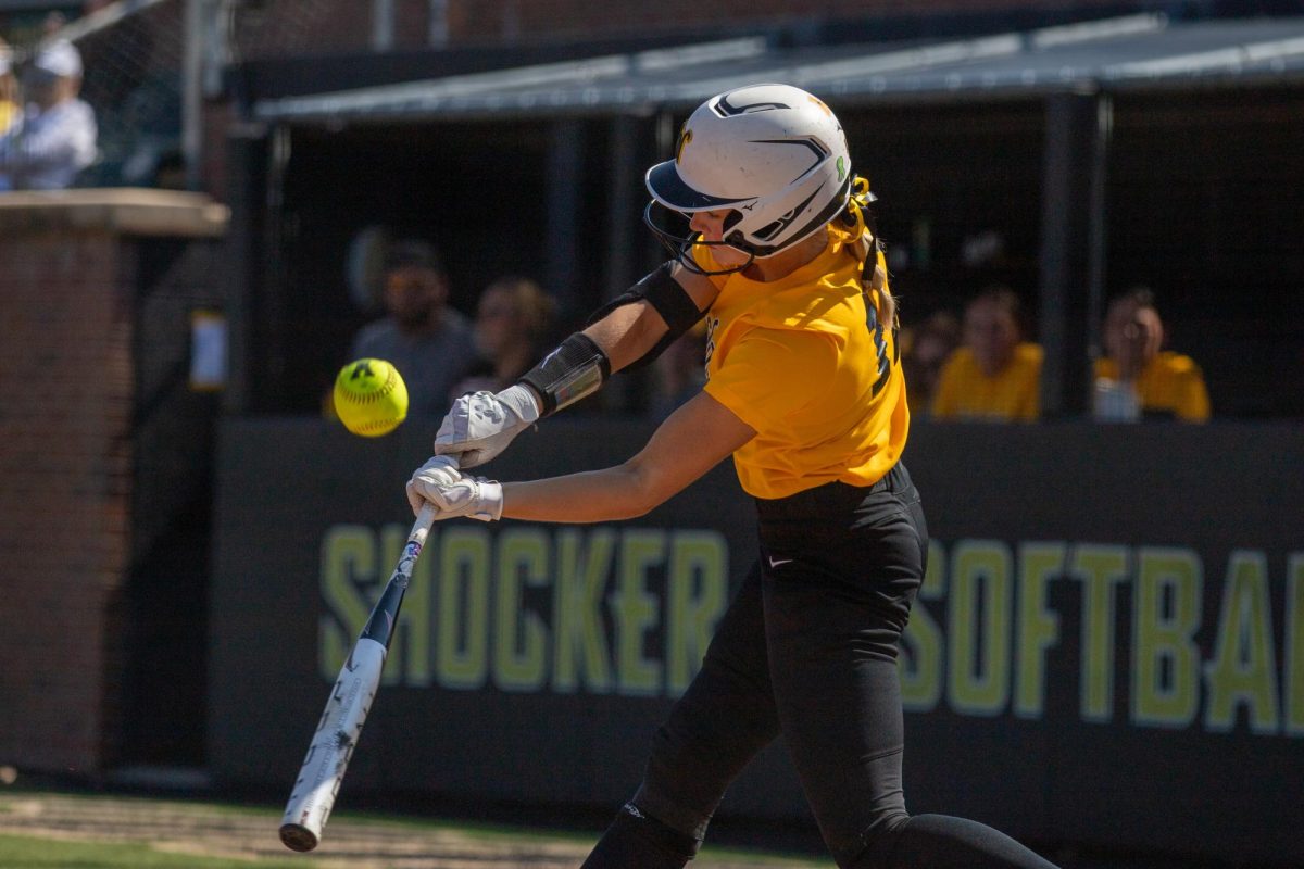 Wichita State softball sophomore Gabby Fakes (12) swings under a pitch against McLennan Community College on Saturday, Oct. 4, 2025, at Wilkins Stadium. Fakes' freshman season at Wisconsin was cut short due to injury and illness.