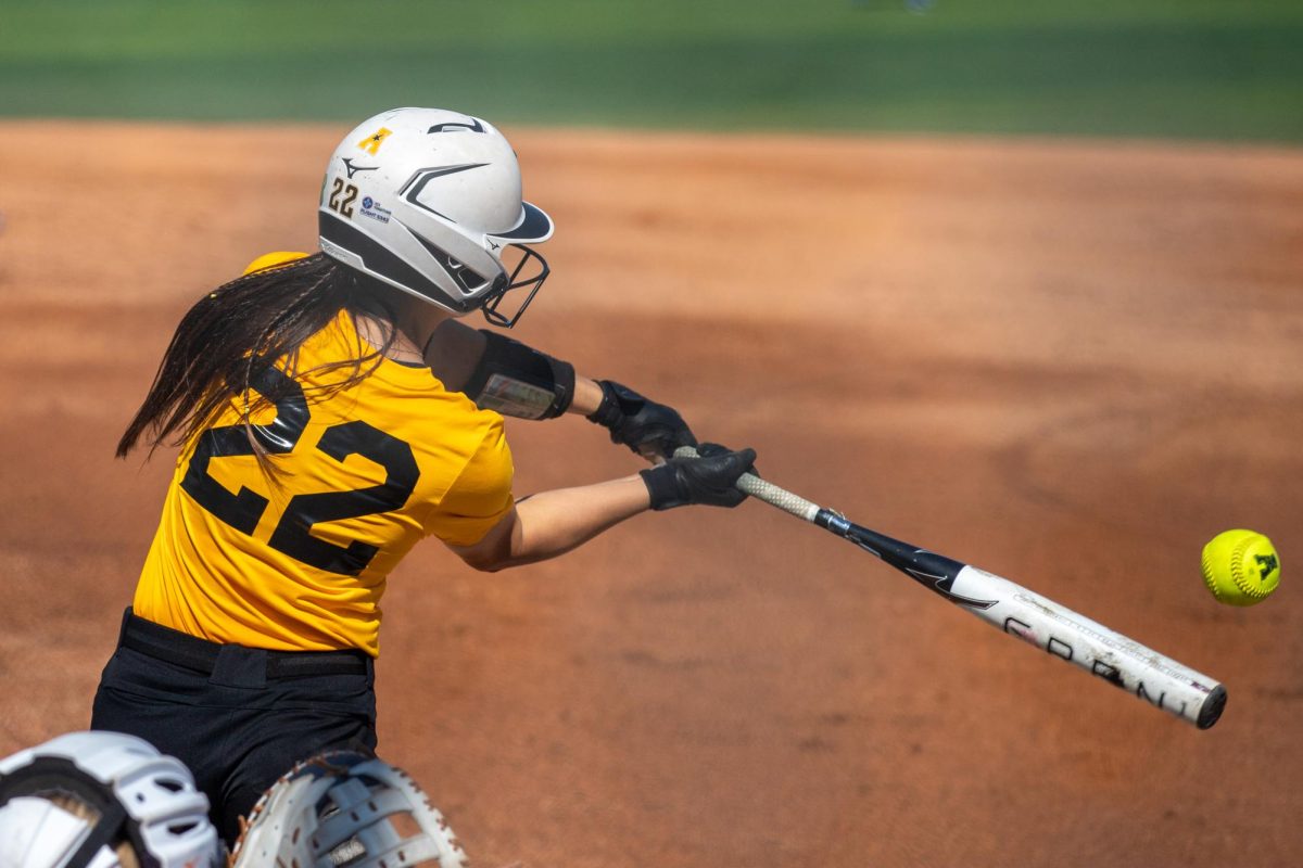 Wichita State softball senior Jodie Epperson (22) swings her bat before contacting the ball against McLennan Community College on Saturday, Oct. 4, 2025, at Wilkins Stadium. Epperson hit .290 last season with 11 doubles.