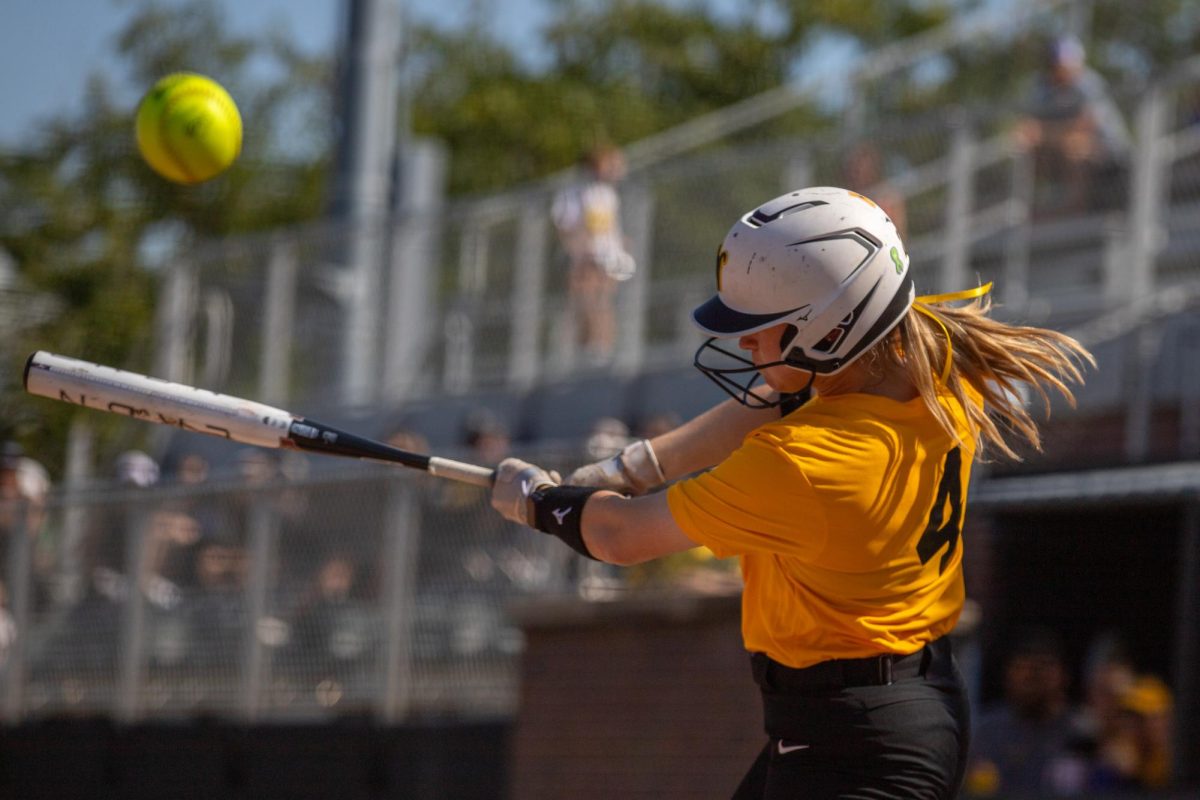 Wichita State softball graduate student Johnna Schroeder (4) fouls off a pitch against McClennan Community College on Saturday, Oct. 4, 2025, at Wilkins Stadium. Schroeder tore both of her ACLs while she played at Stanford.