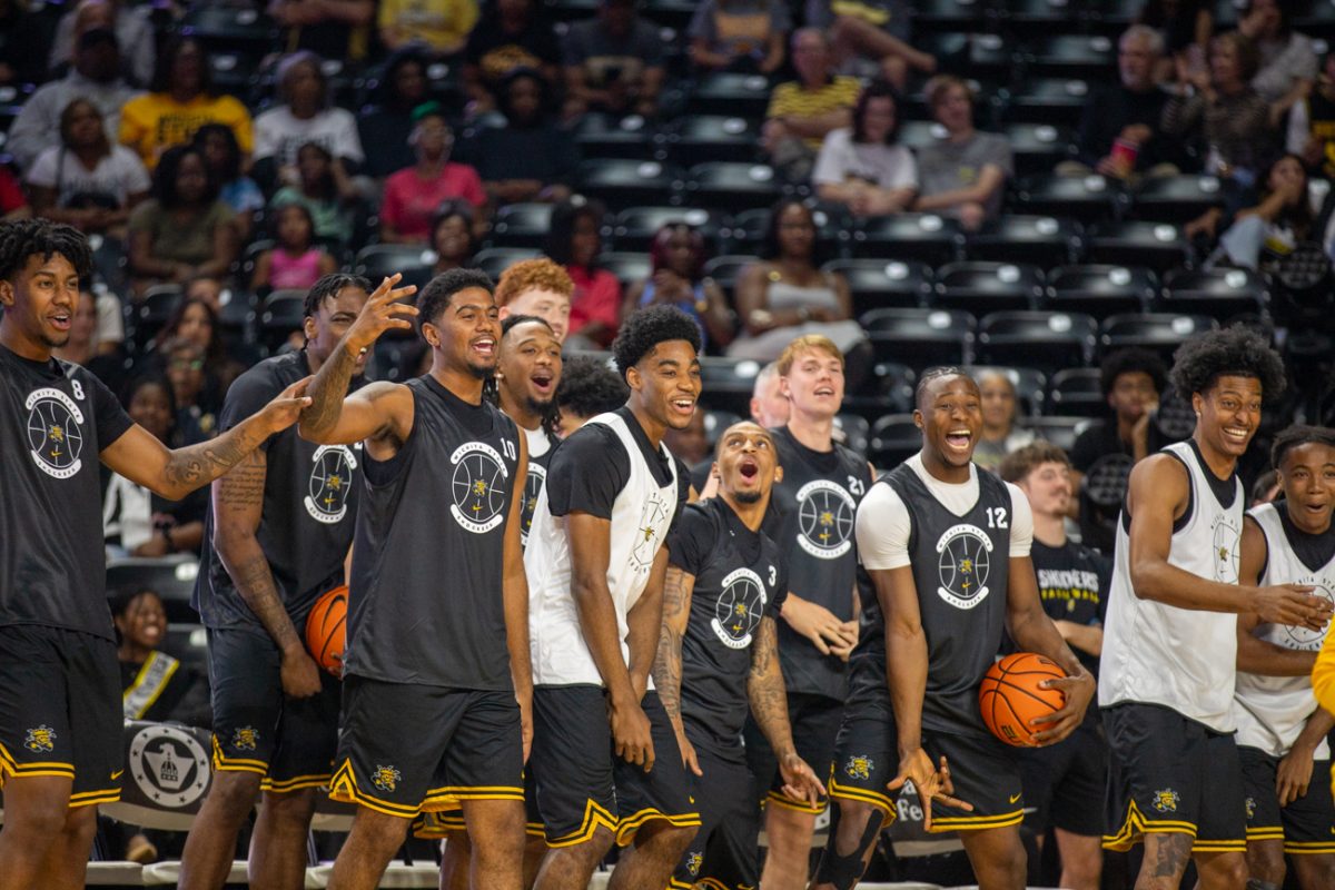 The Wichita State men's basketball team cheers during the 3-point contest at Shocker Madness on Saturday, Oct. 4, 2025, at Koch Arena. Senior Kenyon Giles won the 3-point contest final, 12-11.