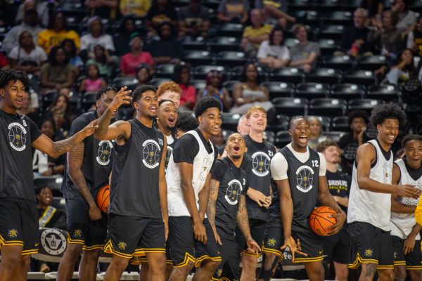 The Wichita State men's basketball team cheers during the 3-point contest at Shocker Madness on Saturday, Oct. 4, 2025, at Koch Arena. Senior Kenyon Giles won the 3-point contest final, 12-11.