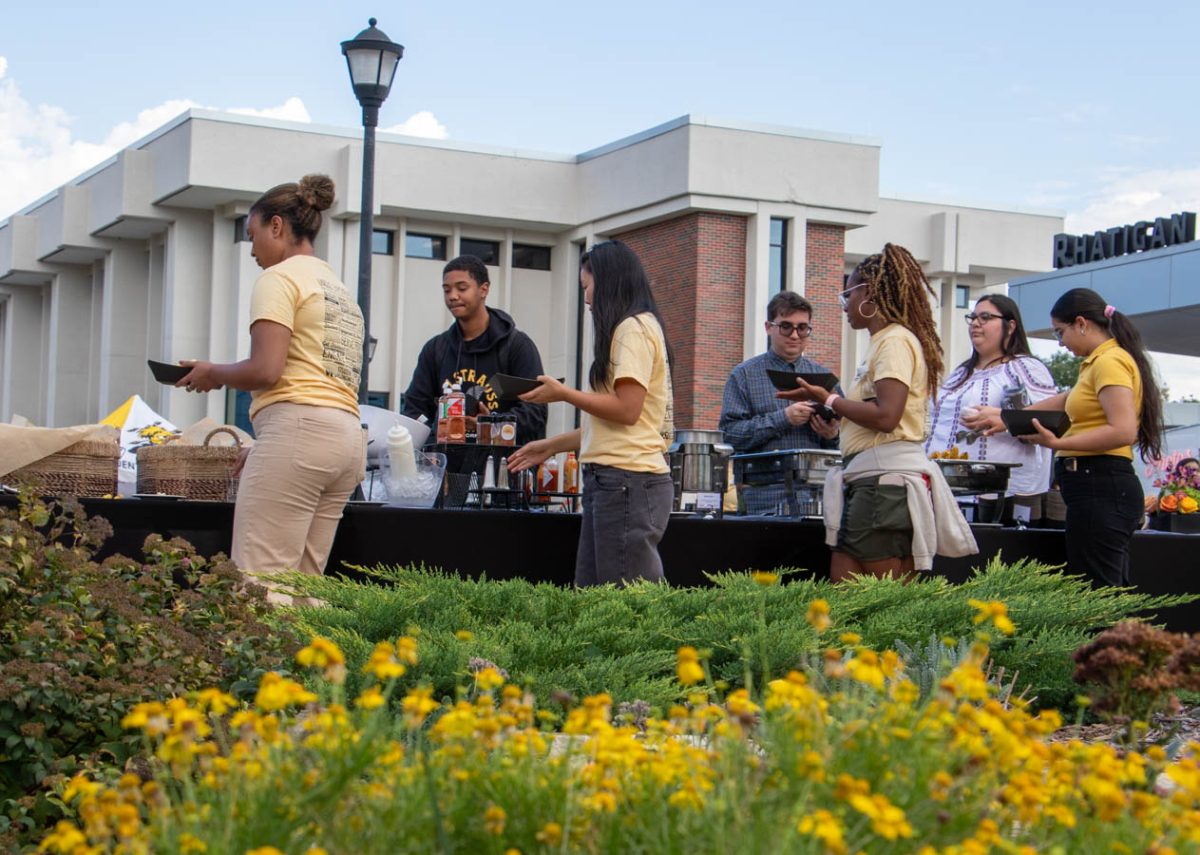 Students plate up buffet-style during the Shocker Corn Roast. The roast is a staple of Wichita State University's Shocktoberfest.