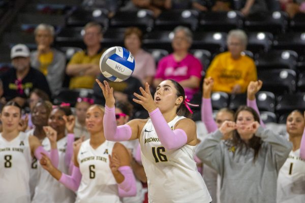 Wichita State volleyball junior Jordan Heatherly (5) serves against Memphis on Friday, Oct. 10, 2025, at Koch Arena. The Shockers made 11 aces in the 3-0 win against the Tigers.