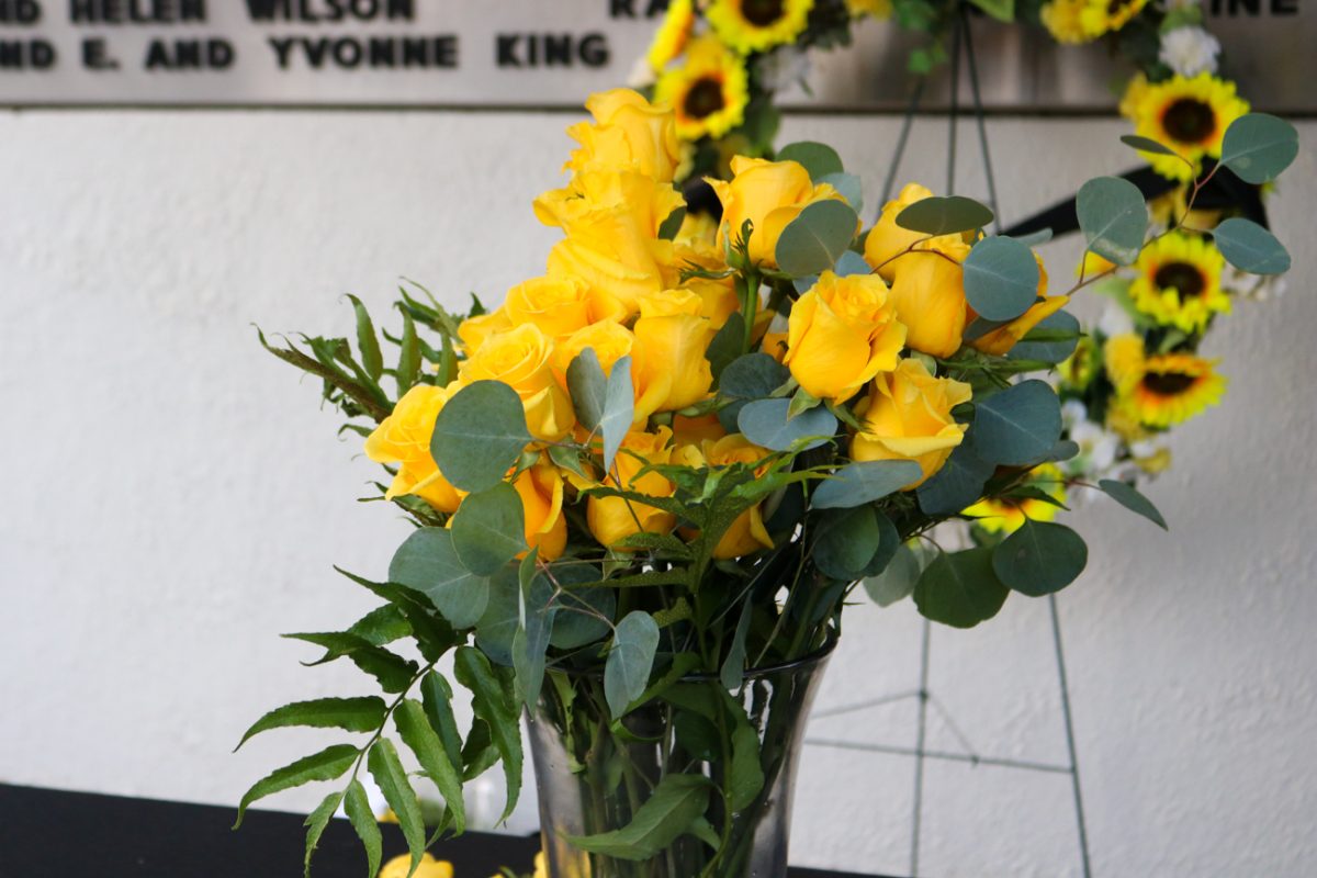 A vase with yellow roses at the Memorial '70 ceremony on Oct. 2, 2025, in Wichita, Kansas represents the lives lost in the 1970 plane crash involving Wichita State's football team. This year was the 55th commemoration of the plane crash in 1970.