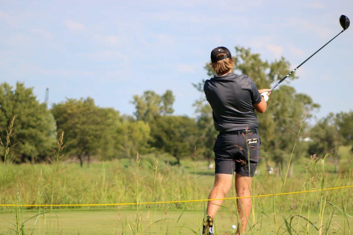 Wichita State men's golf freshman Rhett O'Rear takes a practice swing at the Grier Jones Invitational on Sunday, Oct. 5, 2025, at the Sand Creek Station golf course in Newton, Kansas. O'Rear finished in 38th place, with 221 strokes (+5).