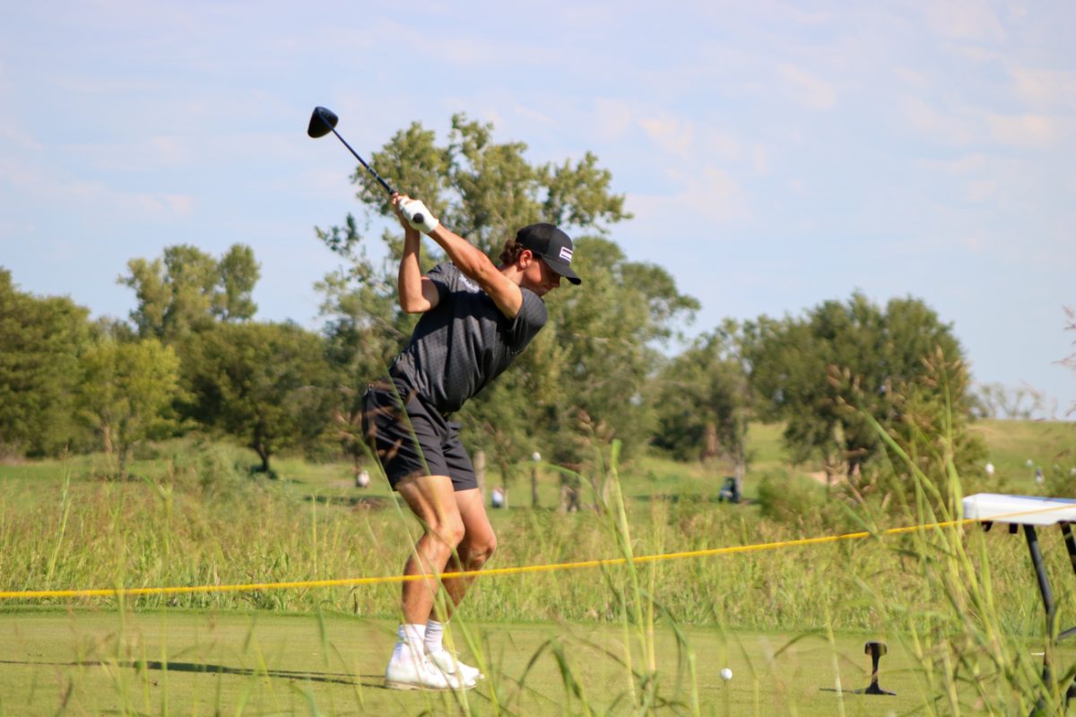 Wichita State men's golf freshman Jace Chaney in his backswing on the tee box at the Grier Jones Invitational on Sunday, Oct. 5, 2025, at the Sand Creek Station golf course in Newton, Kansas. Chaney shot an 83 (+11) in the first round of the tournament.