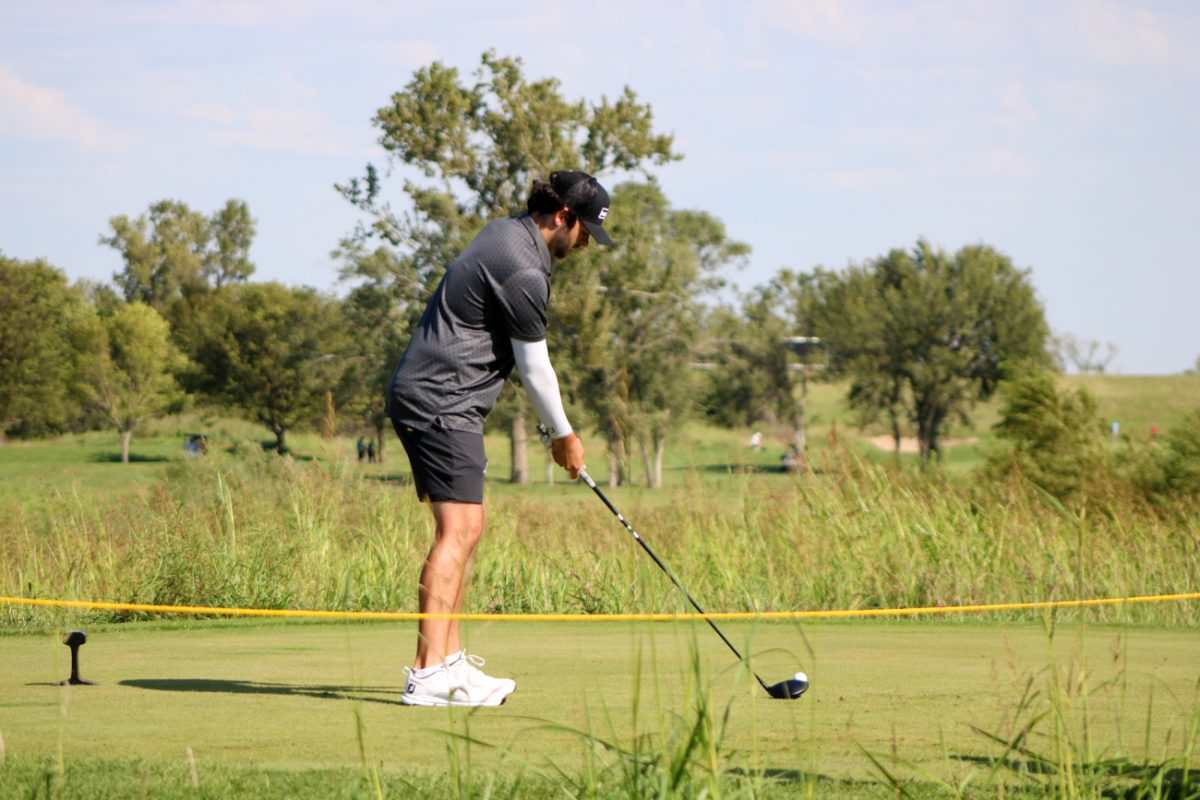 Wichita State men's golf sophomore Caden Cox lines up a tee shot during the Grier Jones Invitational on Sunday, Oct. 5, 2025, at the Sand Creek Station golf course in Newton, Kansas. The Shockers finished in third place, with 865 total strokes (+1).