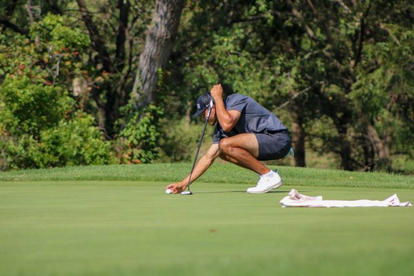 Wichita State men's golf senior Jose Carletta lines up a putt during the Grier Jones Invitational at the Sand Creek Station golf course in Newton, Kansas on Sunday, Oct. 5, 2025. Carletta finished the tournament in 38th place with 221 strokes (+5).