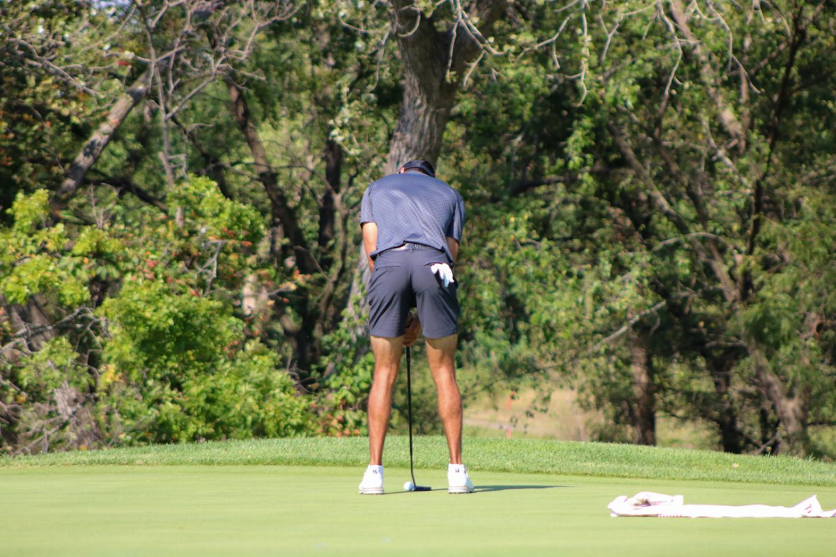 Wichita State men's golf senior Jose Carletta eyes his putting line during the Grier Jones Invitational at the Sand Creek Station golf course in Newton, Kansas on Sunday, Oct. 5, 2025. Carletta sank 10 birdie putts during the 54-hole tournament.