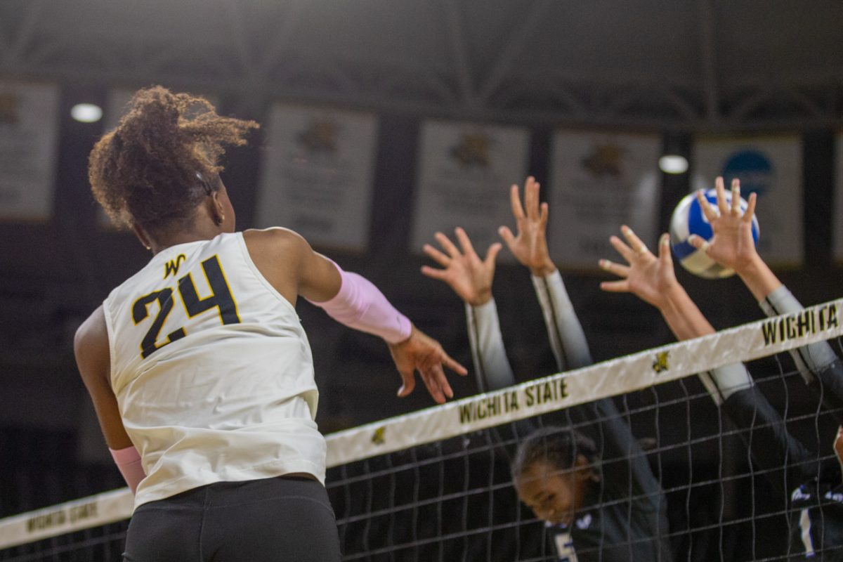 Wichita State freshman McKenzie Jones (24) attacks Memphis' defense on Friday, Oct. 10, 2025, at Koch Arena. Jones made three kills and hit .250.