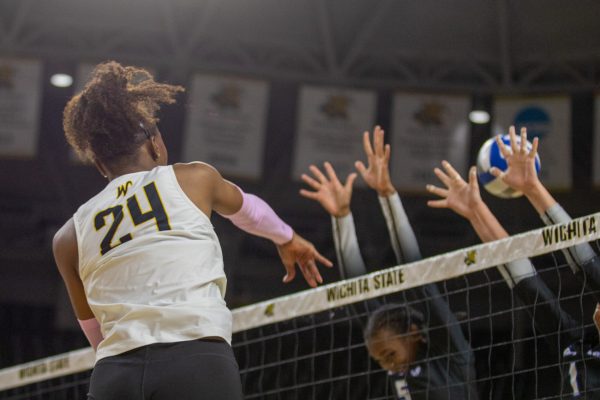 Wichita State freshman McKenzie Jones (24) attacks Memphis' defense on Friday, Oct. 10, 2025, at Koch Arena. Jones made three kills and hit .250.