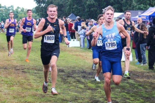 Wichita State cross country senior Ian Hunter sprints to the finish line at the JK Gold Classic on Saturday, Sept. 6, 2025, at LW Clapp Park in Wichita, Kansas. Hunter finished in 42nd place at 20:14:66.