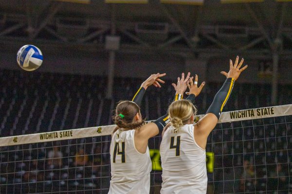 Junior Maddie Wilson (14) and senior Brooklyn Leggett (13) miss a block, which costs them a point against Tulsa on Friday, Oct. 3, 2025, at Koch Arena. Wichita State lost, 3-1.