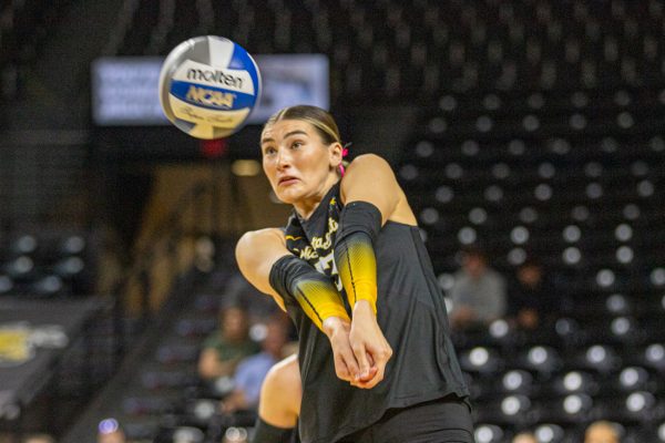 Wichita State volleyball senior Emerson Wilford (13) digs a ball on Sunday, Oct. 12, 2025, at Koch Arena. Wilford made nine digs and seven kills against UAB.