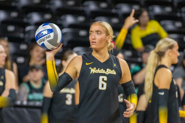 Wichita State volleyball senior Katie Galligan (6) throws the ball to the sideline during timeout against UAB on Sunday, Oct. 12, 2025, at Koch Arena. The Shockers won 3-1 against the Blazers.