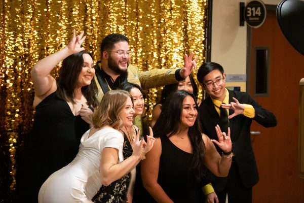 Former Student Body President Kylee Hower (in white) poses with fellow SGA members, including former Student Body Vice President and current Speaker of the Senate Matthew Phan (far right) and Student Body President Jia Wen Wang (right of Hower). Hower will graduate this December after a career in SGA as a senator, speaker of the senate and student body president.