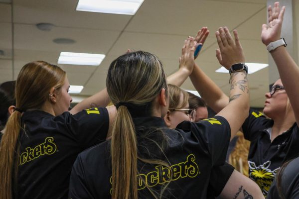 Wichita State's women's bowling team high-fives with senior Paige Wagner (27) during a scrimmage on Friday, Oct. 17, 2025, in the Rhatigan Student Center. The Shockers scrimmaged against No. 8 Sam Houston State and No. 24 Oklahoma Christian.