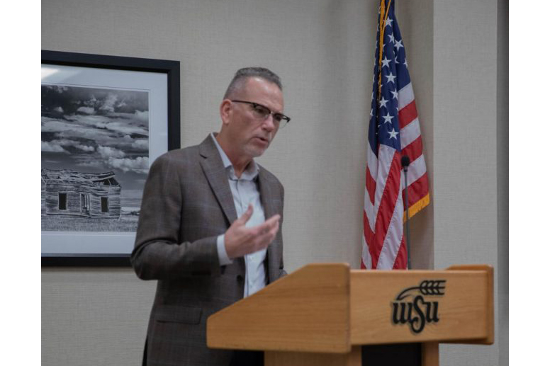 Michael Birzer, a criminal justice professor and graduate coordinator, introduces the panelists of the WSU safety discussion. The panel and following open forum was held on Nov. 9 and shared the perspectives of various important faculty figures regarding campus safety.