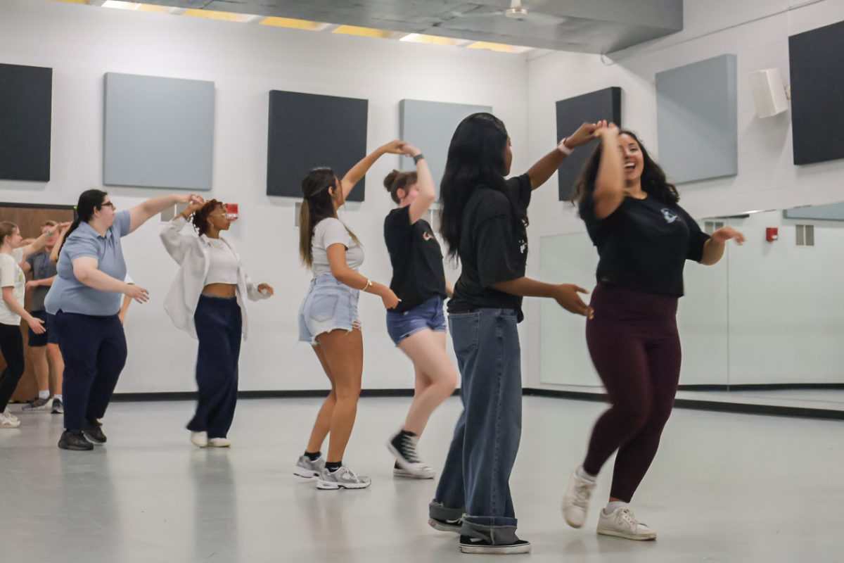 Atendees of the dance through the diaspora event learn to execute a turn correctly while dancing the bachata. The event took place Thursday, Oct. 9 in the Heskett Center.