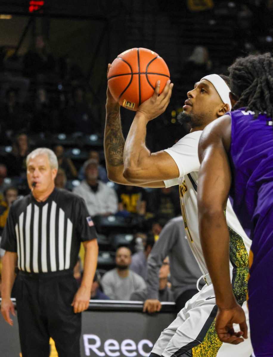 Wichita State redshirt freshman TJ Williams (4) shoots a free throw against Prairie View A&M on Nov. 8. Williams shot 10-of-10 from the charity stripe in the 105-62 win.