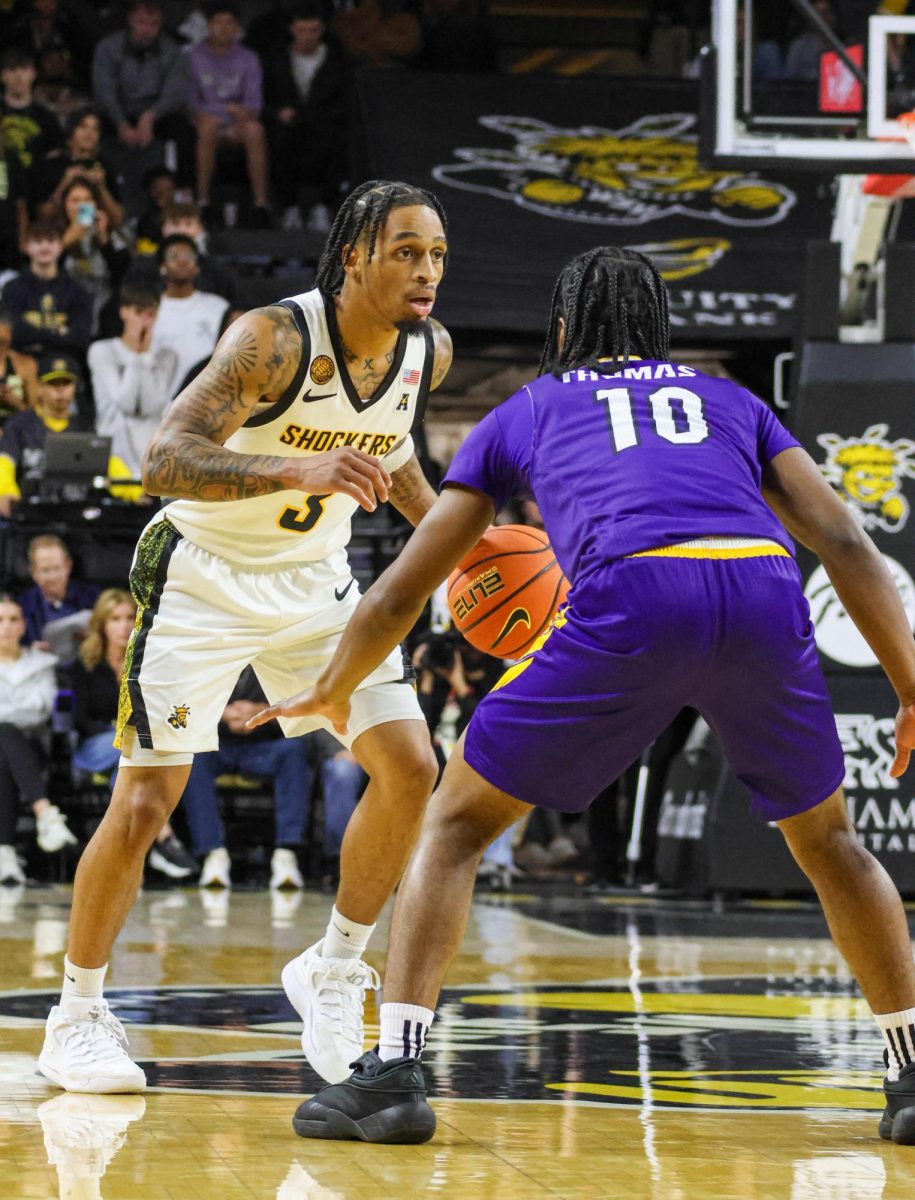 Wichita State junior Dre Kindell (3) attempts to drive the ball past a Prairie View A&M defender on Nov. 8. Kindell scored 15 points off the bench for the Shockers.