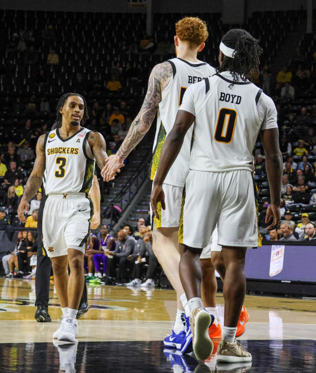 Wichita State junior Dre Kindell (3) high-fives with redshirt junior Will Berg (44) on Nov. 8. The Shockers beat Prairie View A&M, 105-62.