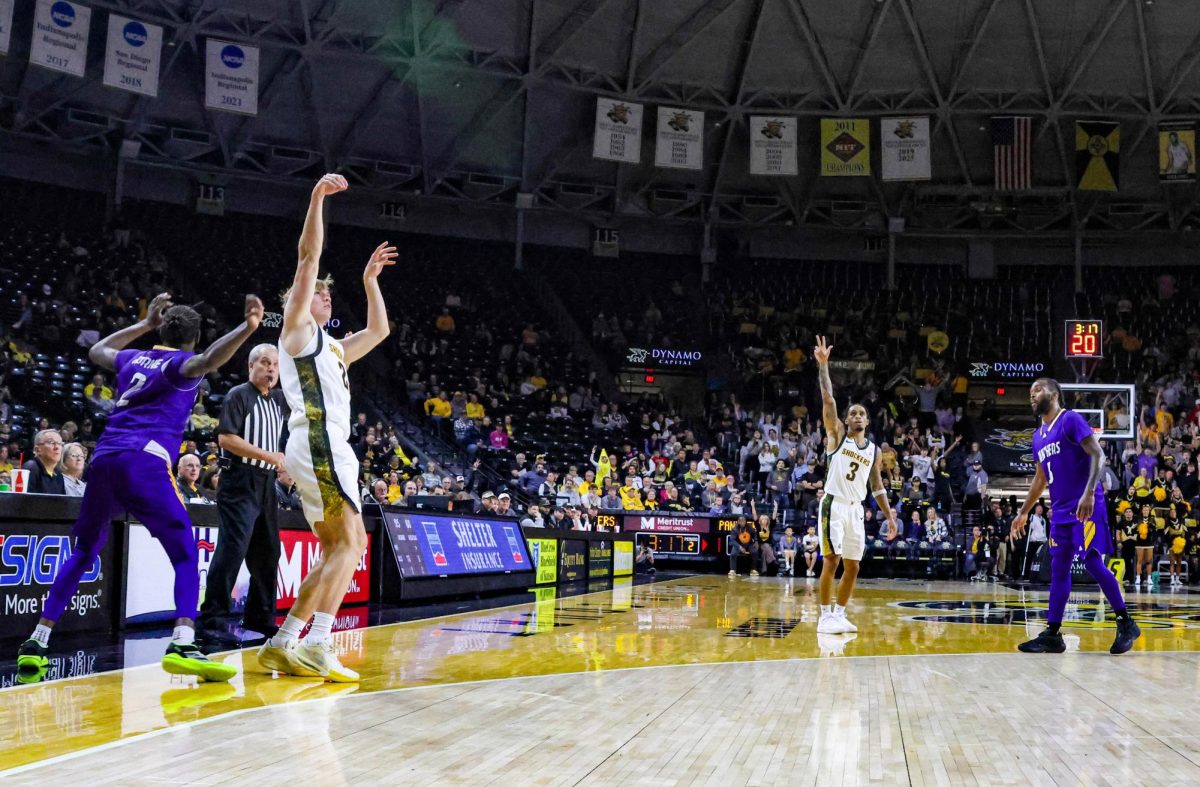 Wichita State redshirt junior Henry Thengvall (21) attempts a 3-pointer against Prairie View A&M on Nov. 8. The Shockers shot 54.5% from deep during the win.