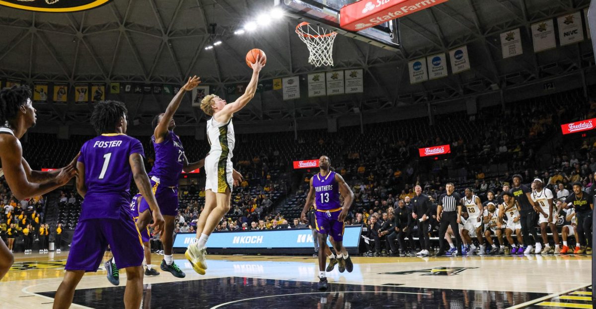 Wichita State redshirt junior Henry Thengvall (21) shoots a layup against Prairie View A&M on Nov. 8. The Shockers won by 43 points, 105-62.