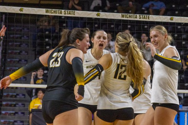 Wichita State's volleyball team cheers after a kill against East Carolina on Nov. 7. The Shockers hit .276 in the sweep over the Pirates. (File photo)