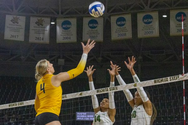Wichita State volleyball redshirt senior right-side Brooklyn Leggett (4) tips the ball across the net against Charlotte on Nov. 9. (File photo)