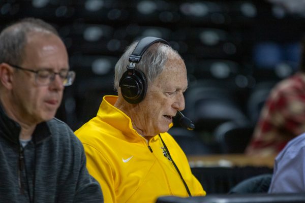 Wichita State Athletics radio broadcaster Mike Kennedy speaks into the microphone at a men's basketball game on Nov. 22. Kennedy, who has broadcasted Shocker games for 46 years, will retire after the conclusion of the 2025-26 season.