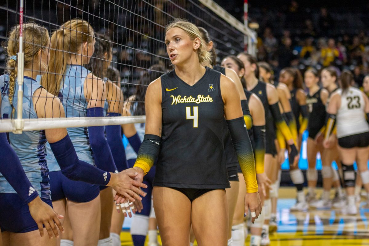 Wichita State volleyball senior right-side Brooklyn Leggett (4) shakes hands with Rice after the match on Nov. 14. (File photo)
