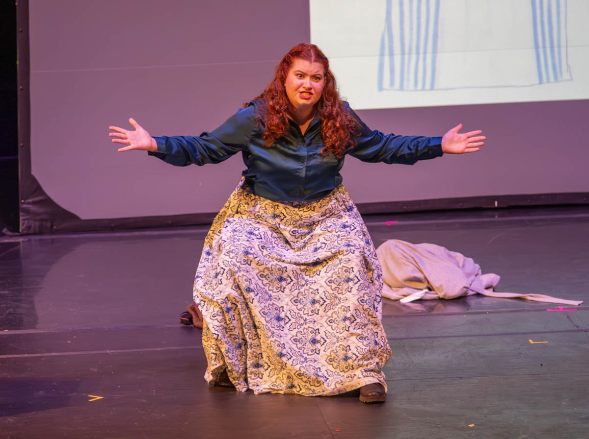 Mia Dennett performs at the School of Performing Arts' Capstone Celebration. Dennett displayed characterization through performance and design with a small snippet of five different characters, all played by themself.