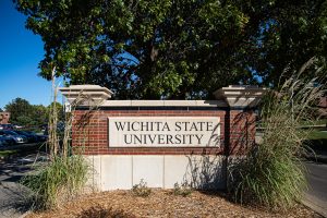 The entrance sign at the corner of Hillside Street and Memorial Drive. Similar signs are placed at multiple entrances around campus. (File photo)