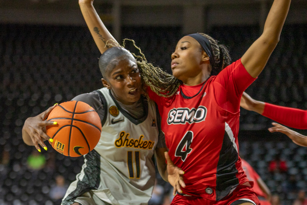 Wichita State women's basketball junior forward Jaida McDonald (11) guards the ball before taking a shot on Nov. 18. (File photo)