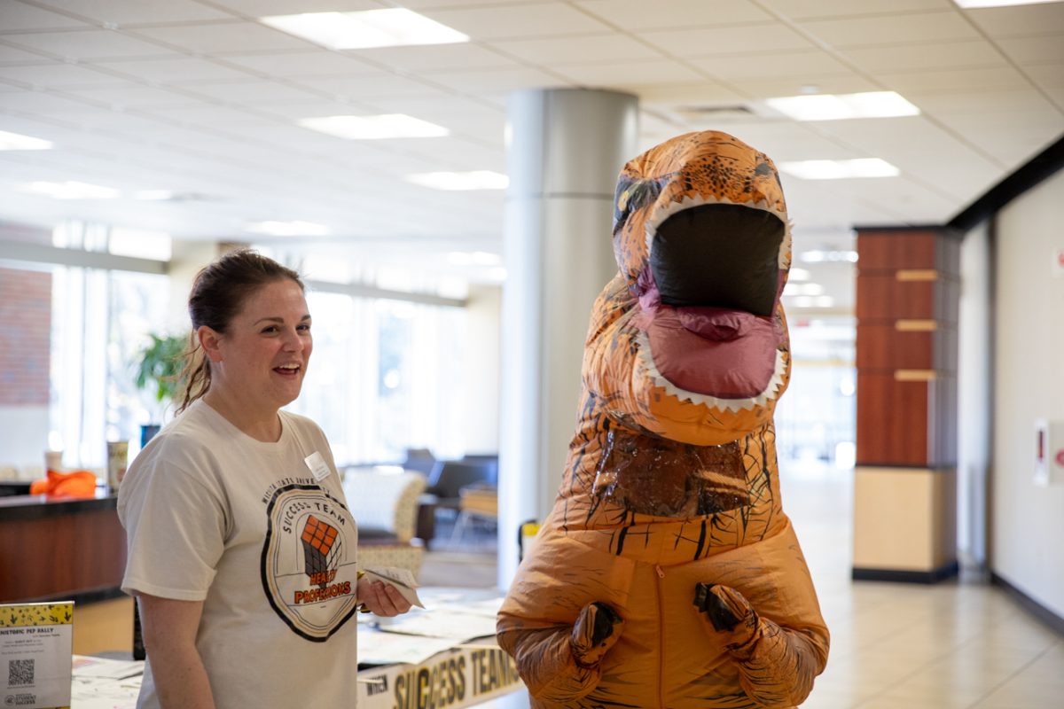 Success coach Caitlin Bruner and Reserve Specialist Sarah Rue laugh in the RSC. The Dino Pep Rally was hosted on Dec. 2.
