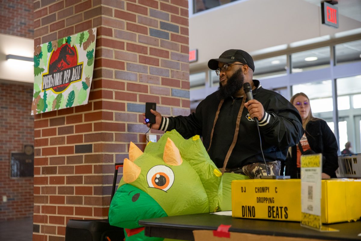 Courtney Lockhart, lead case manager and advocate of the Student Outreach Service, dances to a song. Lockhart played the music in the RSC on Dec. 2.