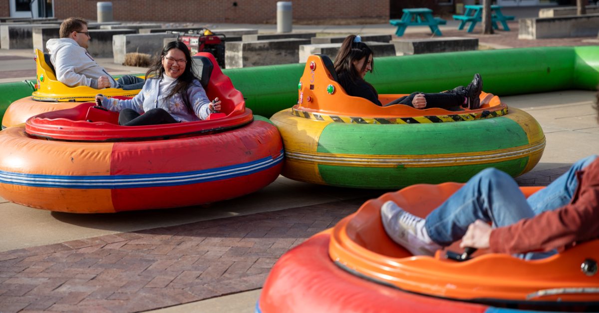 Students in a rear-end collision on the bumper cars. Attendees had up to four bumper cars to play with.