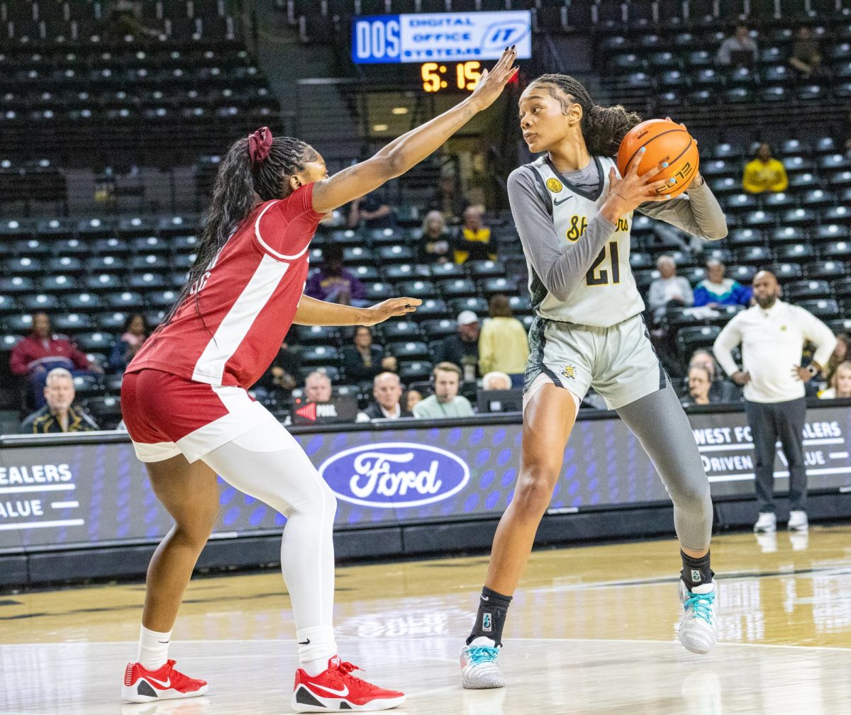 Wichita State women's basketball graduate forward Treasure Thompson (21) looks to pass the ball on Jan. 6. The Shockers lost to the Owls 70-50.