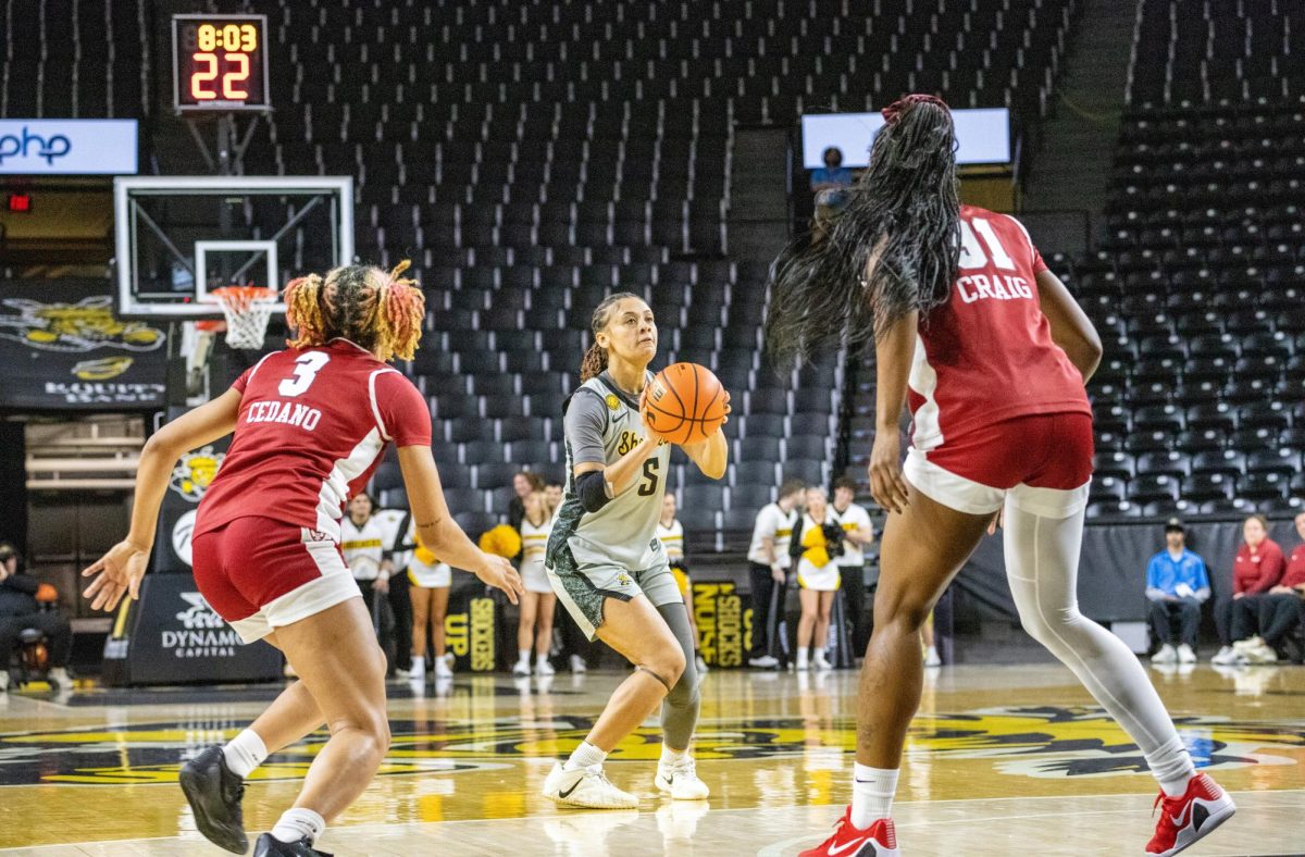 Wichita State women's basketball graduate guard Diamond Richardson (5) attempts a 3-point shot against the Temple Owls on Jan. 6. Richardson finished the game with 10 points on 2-of-6 shooting.