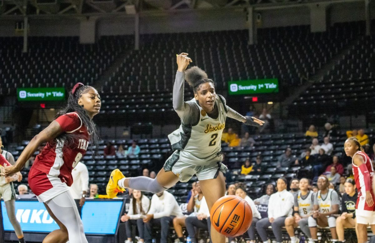 Wichita State women's basketball graduate guard Abby Cater (2) loses control of the ball against the Temple Owls on Jan. 6. Cater ended the night with seven points in the Shockers' 70-50 loss.