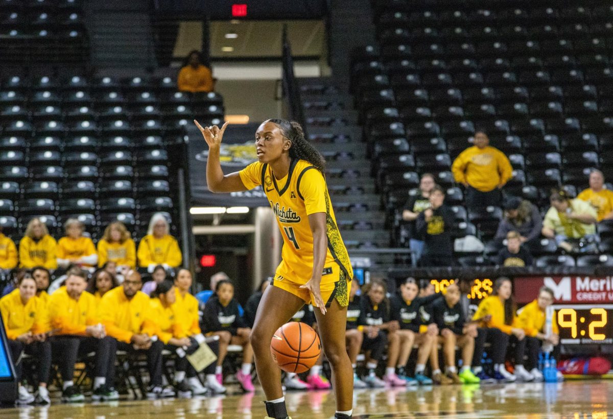 Wichita State women's basketball graduate guard Jaila Harding (4) signals a play against East Carolina on Jan. 10. The Shockers lost, 83-56.